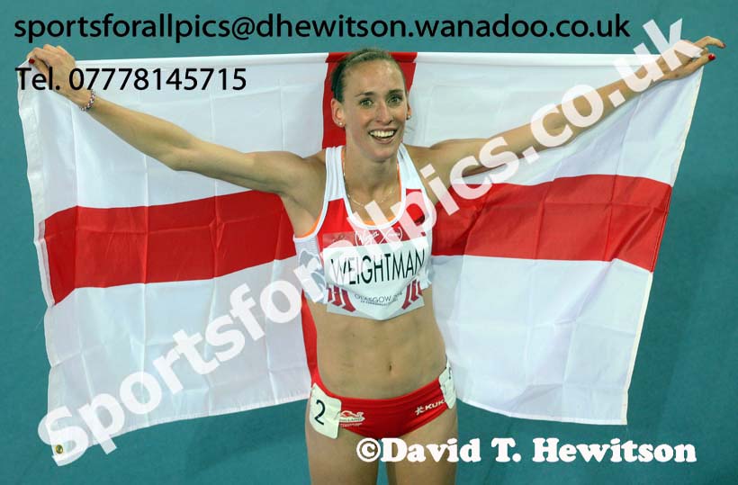 Laura Weightman (England) with the England flag after finishing 2nd in the 1500 metres, 2014 Commonwealth Games, Glasgow. Photo: David T. Hewitson/Sports for All Pics